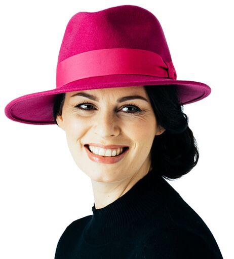 Lady wearing a stylish pink hat